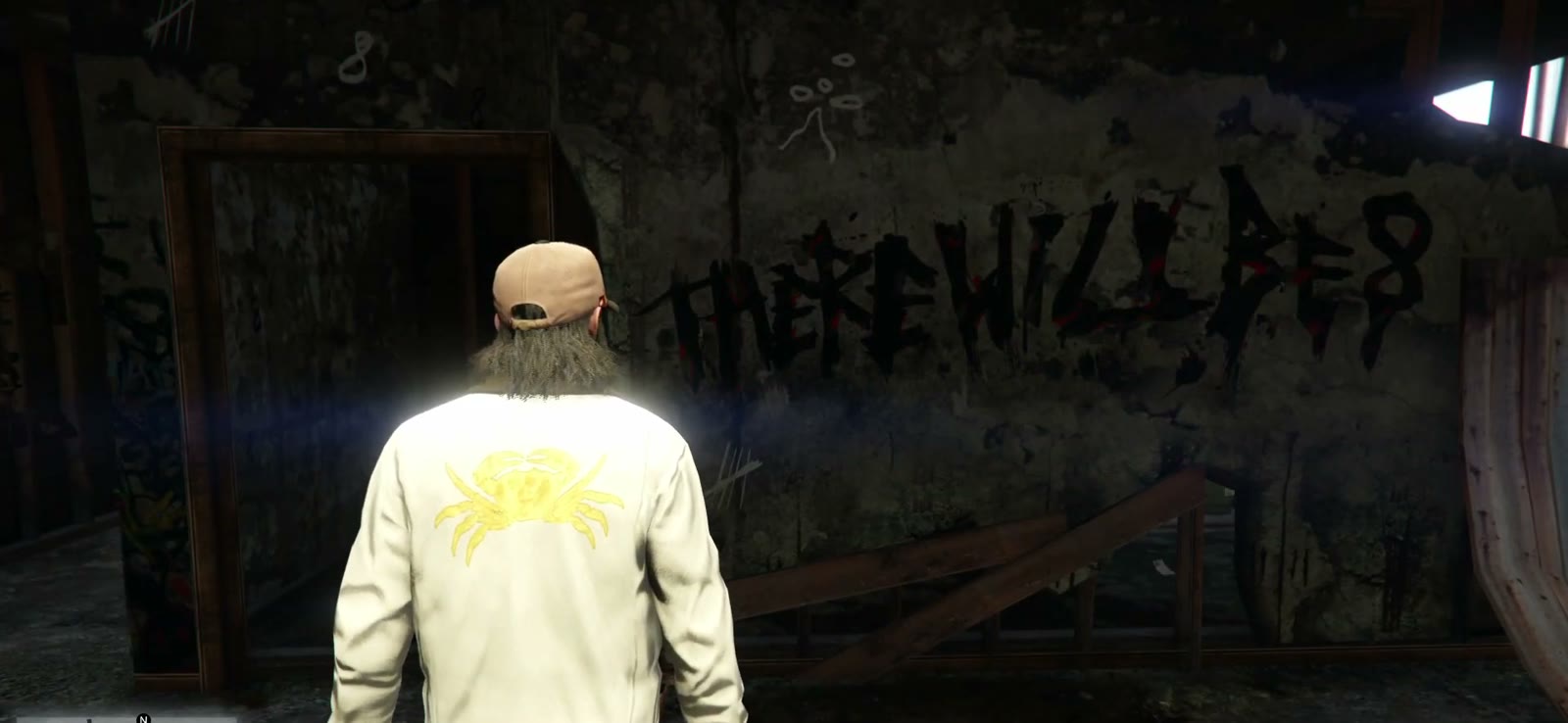 L'inscription « There will be 8 » sur le mur de la maison brûlée de Merle Abrahams à Sandy Shores dans GTA V