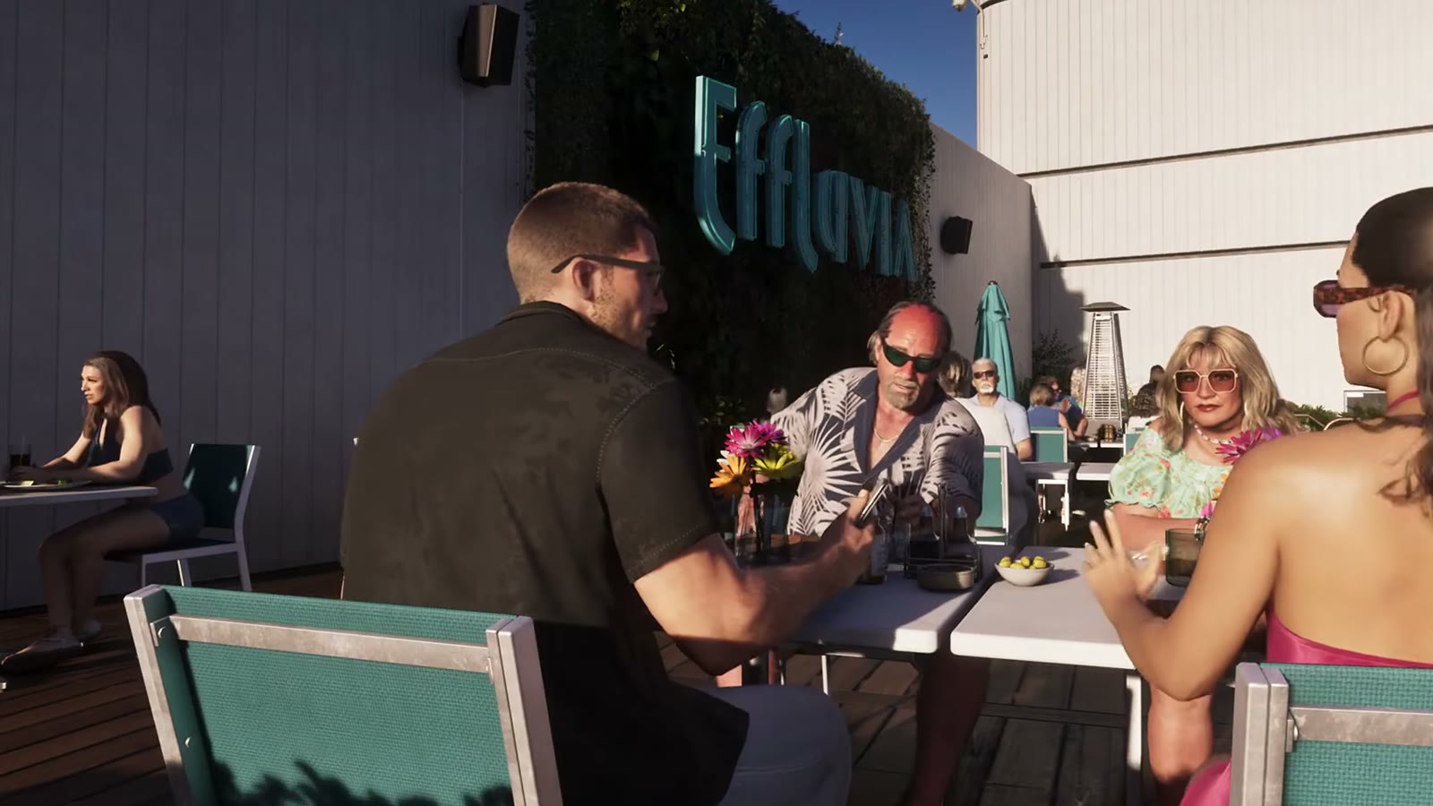 Brian Heder et Lori attablés avec Jason et Lucia sur la terrasse de l'Effluvia