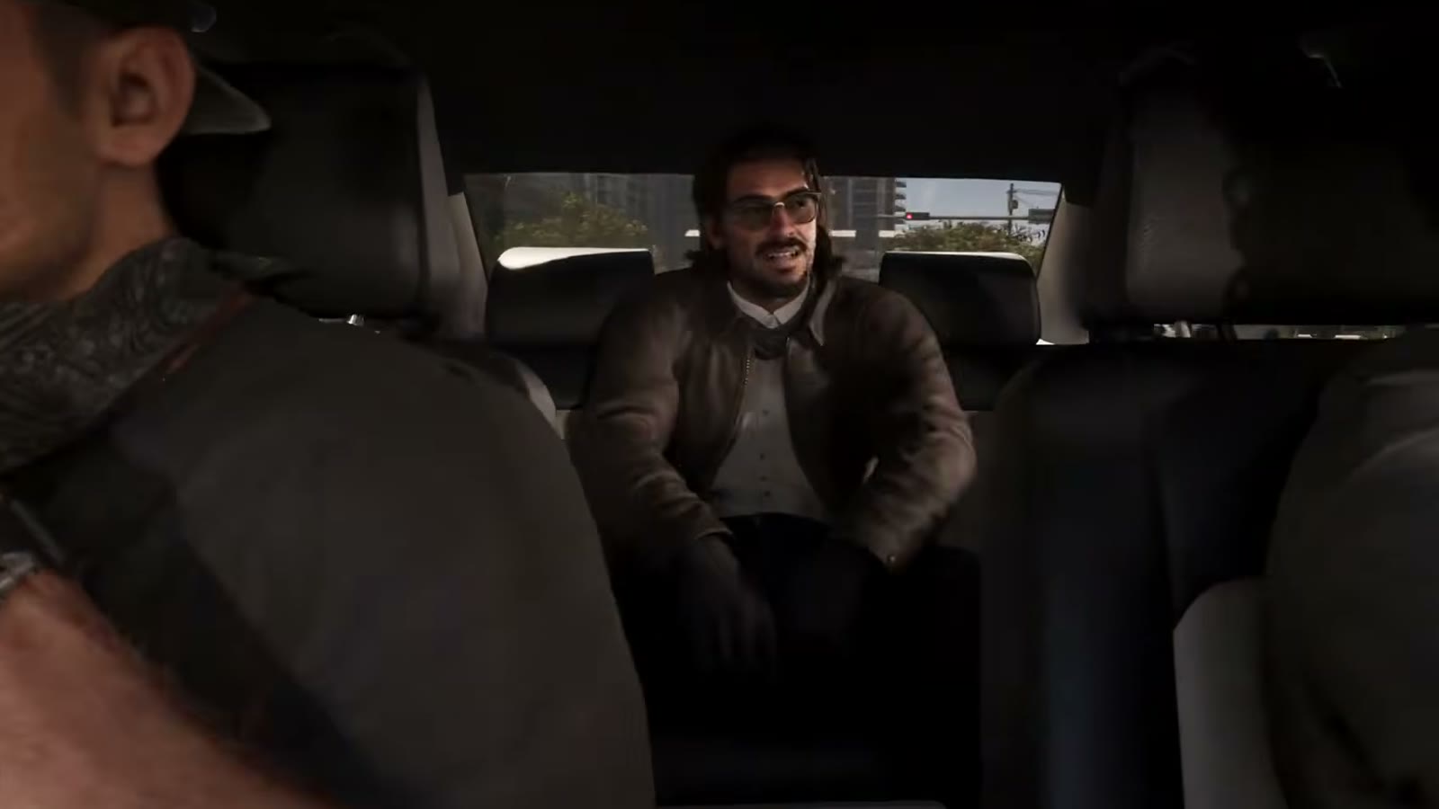Raul Bautista assis à l'arrière de la voiture de fuite après le braquage