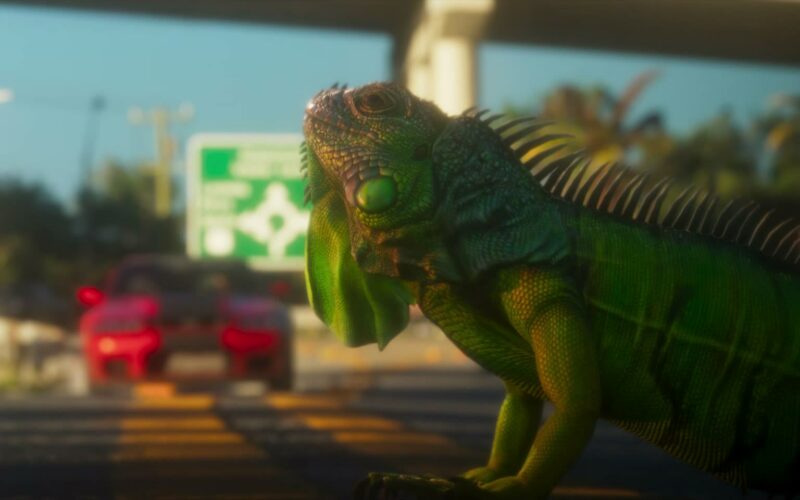 Gros plan sur un iguane vert au bord d’une route de Leonida dans le trailer de lancement de GTA VI